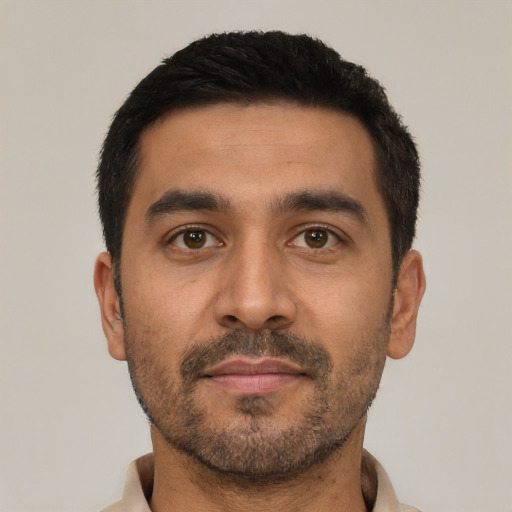 Neutral latino young-adult male with short  black hair and brown eyes
