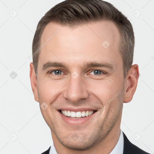 Joyful white young-adult male with short  brown hair and brown eyes