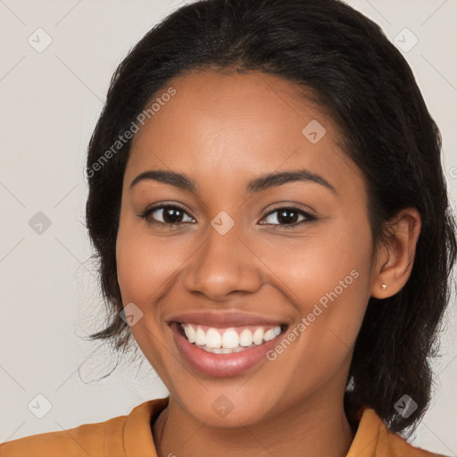 Joyful latino young-adult female with medium  brown hair and brown eyes