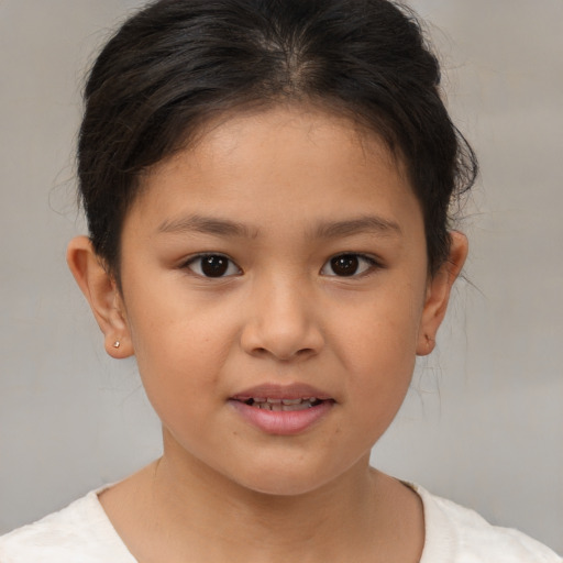 Joyful white child female with medium  brown hair and brown eyes