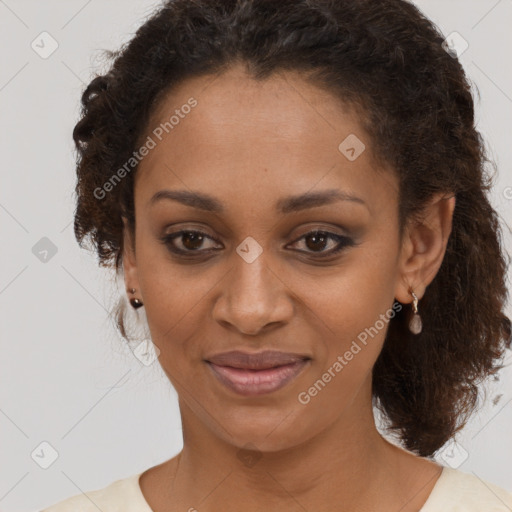 Joyful black young-adult female with medium  brown hair and brown eyes