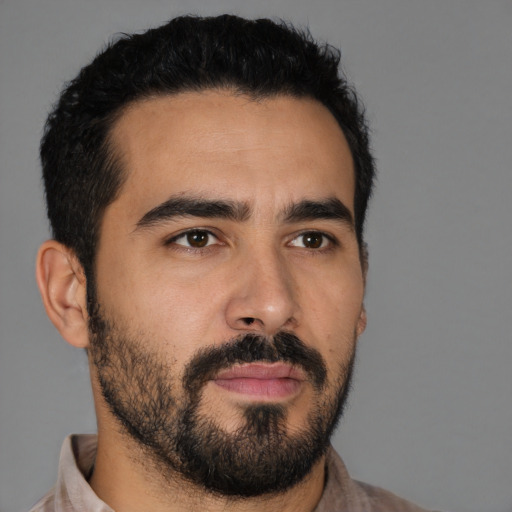 Neutral latino young-adult male with short  black hair and brown eyes