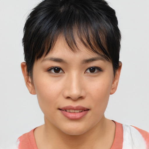 Joyful asian young-adult female with short  brown hair and brown eyes