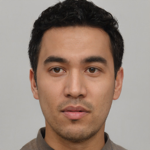 Neutral latino young-adult male with short  black hair and brown eyes