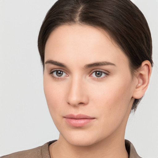 Neutral white young-adult female with short  brown hair and brown eyes