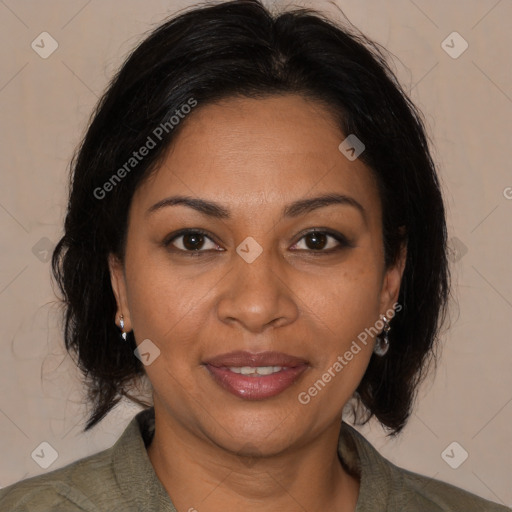 Joyful black adult female with medium  brown hair and brown eyes