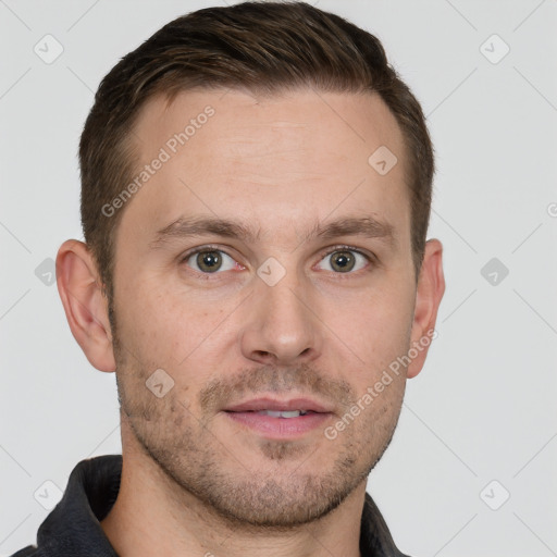 Joyful white young-adult male with short  brown hair and grey eyes