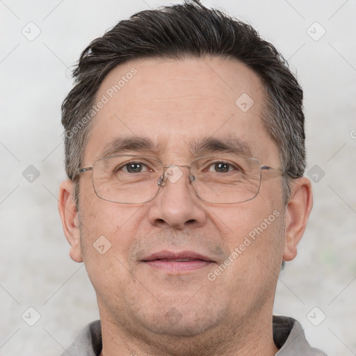 Joyful white adult male with short  brown hair and brown eyes