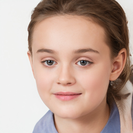 Joyful white child female with long  brown hair and brown eyes