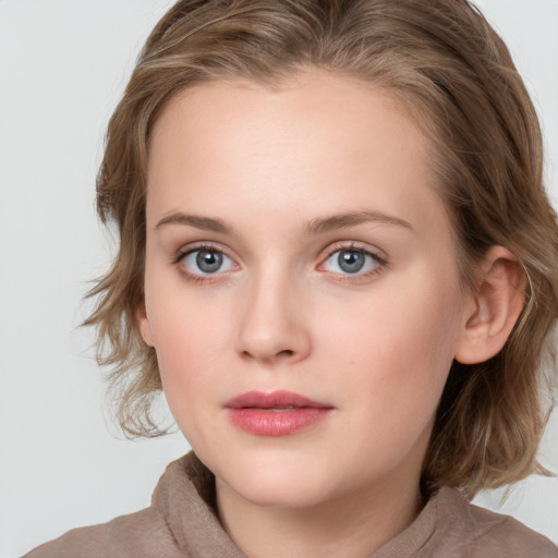 Neutral white young-adult female with medium  brown hair and blue eyes