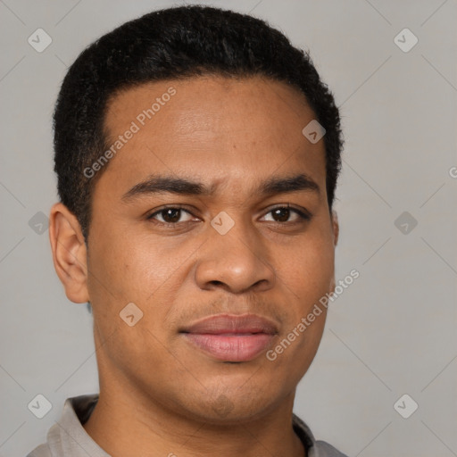 Joyful latino young-adult male with short  brown hair and brown eyes