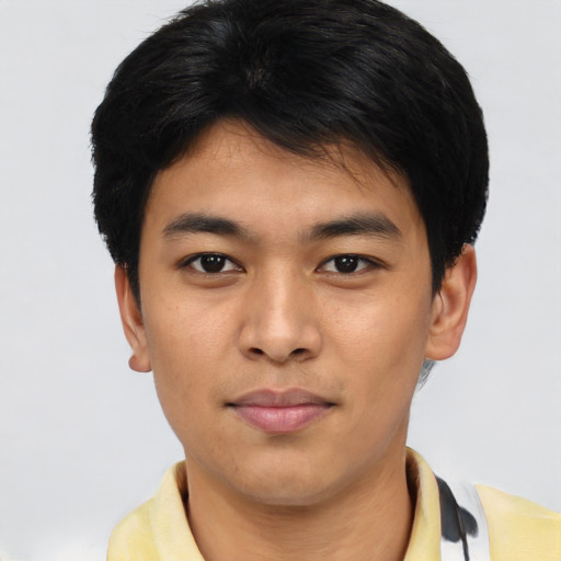 Joyful asian young-adult male with short  brown hair and brown eyes