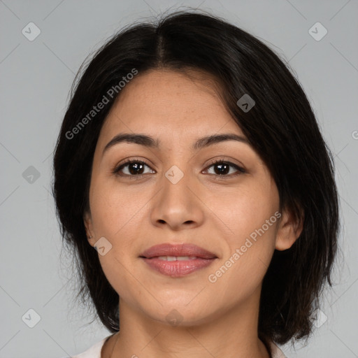 Joyful latino young-adult female with medium  brown hair and brown eyes