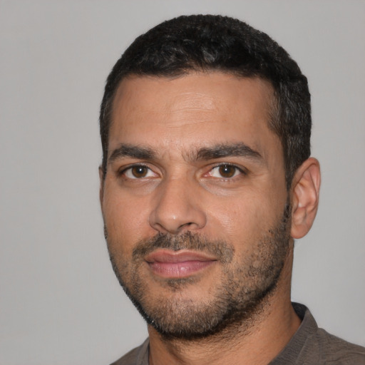 Neutral latino adult male with short  black hair and brown eyes