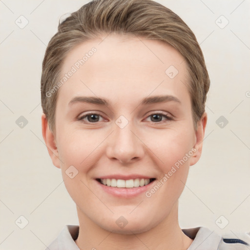 Joyful white young-adult female with short  brown hair and grey eyes