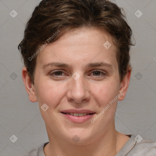 Joyful white adult female with short  brown hair and grey eyes