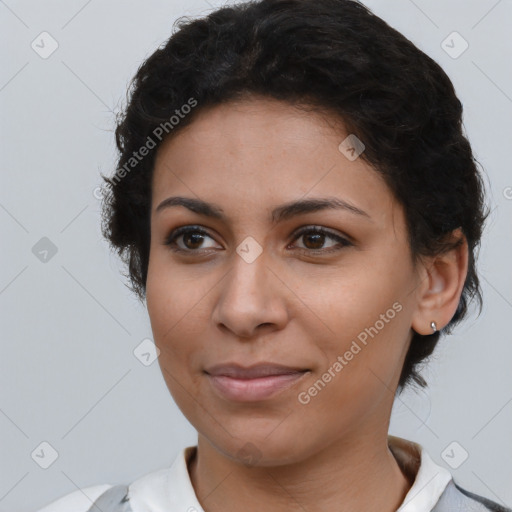 Joyful latino young-adult female with short  brown hair and brown eyes