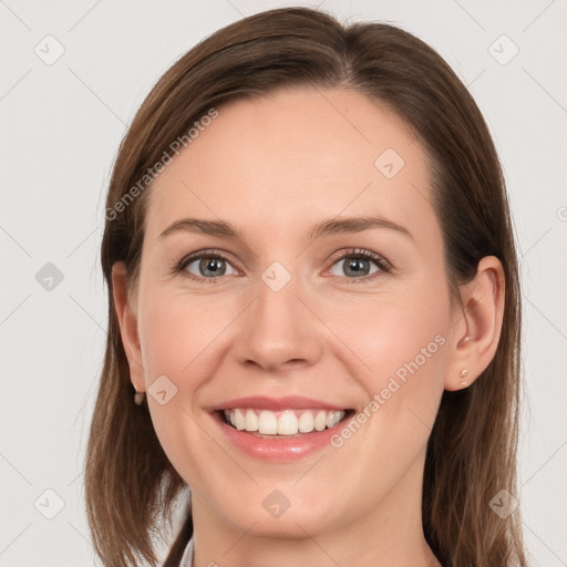 Joyful white young-adult female with long  brown hair and grey eyes