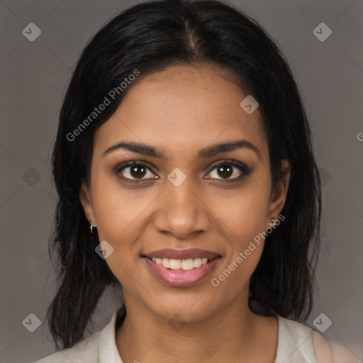 Joyful black young-adult female with medium  brown hair and brown eyes