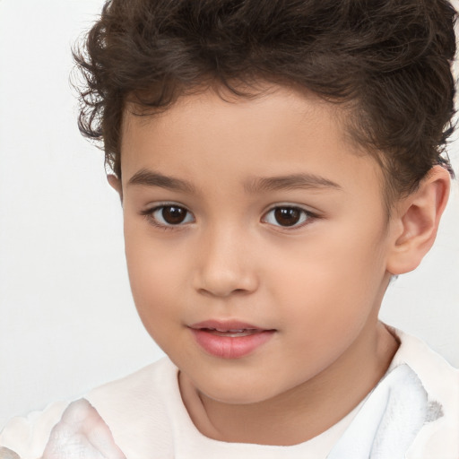 Joyful white child male with short  brown hair and brown eyes