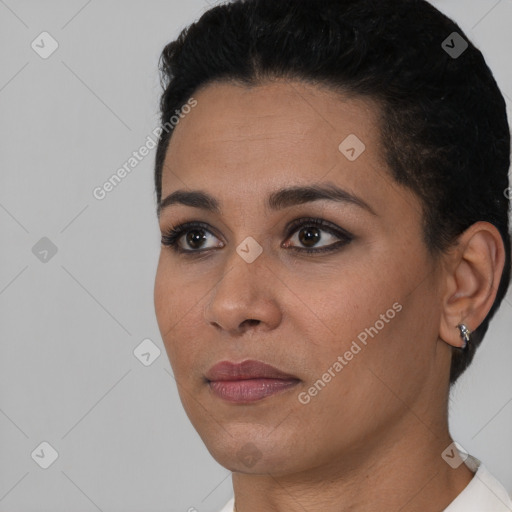 Joyful latino young-adult female with short  black hair and brown eyes