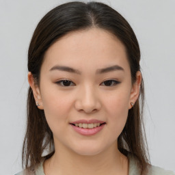 Joyful asian young-adult female with medium  brown hair and brown eyes