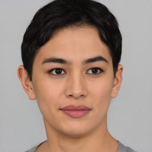 Joyful asian young-adult female with short  black hair and brown eyes