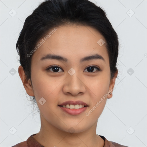 Joyful asian young-adult female with short  brown hair and brown eyes