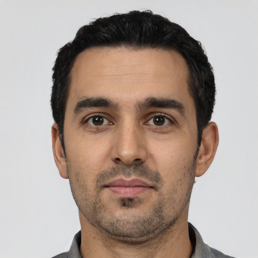 Neutral latino young-adult male with short  black hair and brown eyes