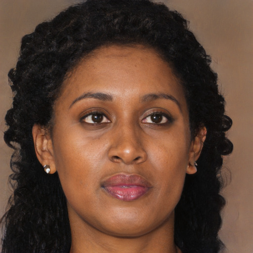 Neutral black young-adult female with long  brown hair and brown eyes