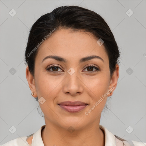 Joyful latino young-adult female with short  brown hair and brown eyes