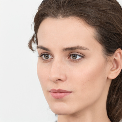 Neutral white young-adult female with medium  brown hair and grey eyes