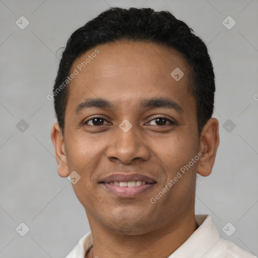 Joyful latino young-adult male with short  black hair and brown eyes