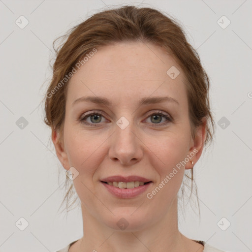 Joyful white young-adult female with medium  brown hair and green eyes