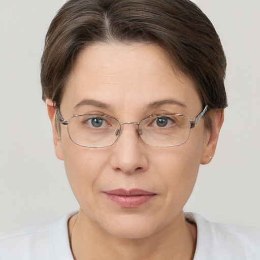 Joyful white adult female with short  brown hair and brown eyes