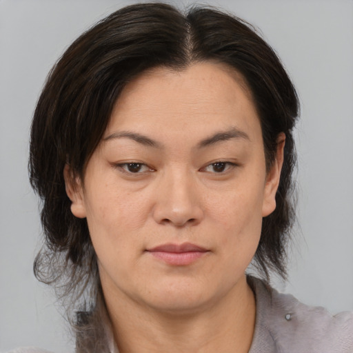 Neutral asian young-adult female with medium  brown hair and brown eyes