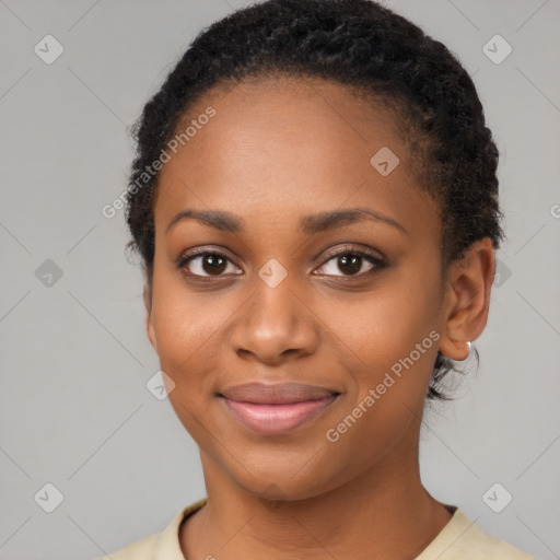 Joyful black young-adult female with short  brown hair and brown eyes