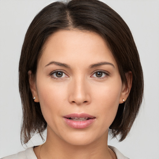 Neutral white young-adult female with medium  brown hair and brown eyes