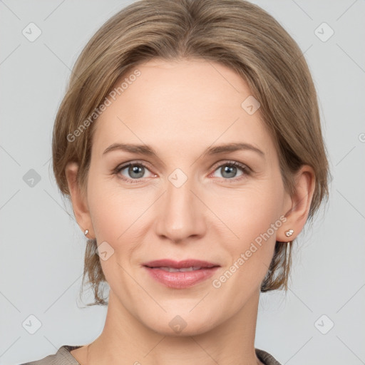 Joyful white adult female with medium  brown hair and grey eyes