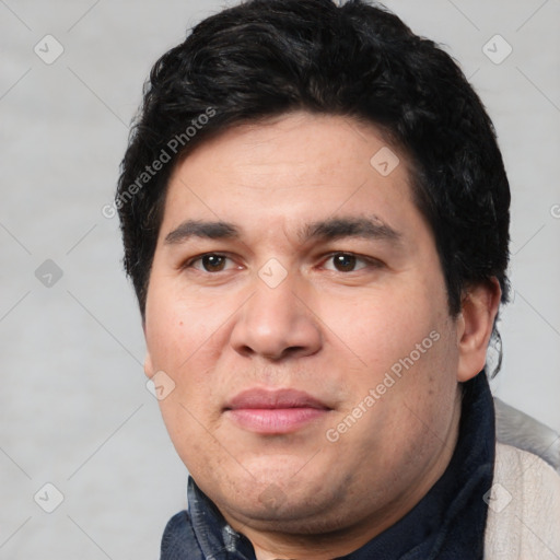 Joyful white adult male with short  black hair and brown eyes