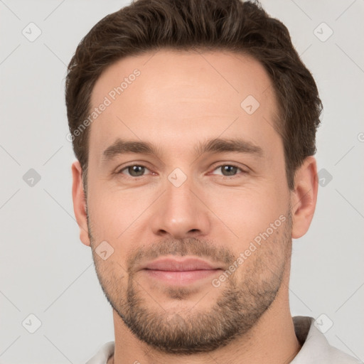 Joyful white young-adult male with short  brown hair and brown eyes