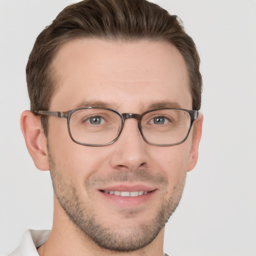 Joyful white young-adult male with short  brown hair and brown eyes