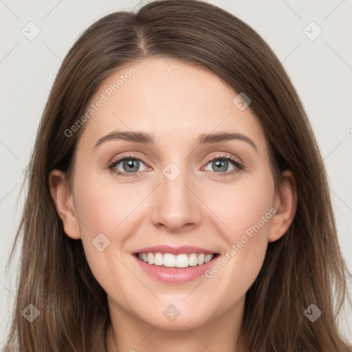 Joyful white young-adult female with long  brown hair and grey eyes