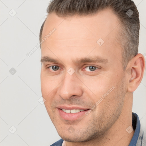 Joyful white young-adult male with short  brown hair and brown eyes