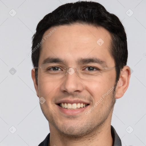 Joyful white young-adult male with short  black hair and brown eyes