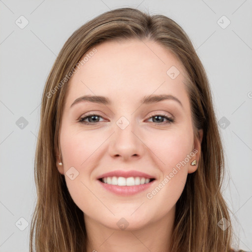 Joyful white young-adult female with long  brown hair and grey eyes