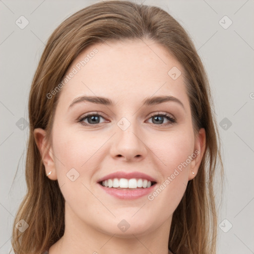 Joyful white young-adult female with long  brown hair and grey eyes