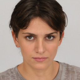 Neutral white young-adult female with short  brown hair and brown eyes