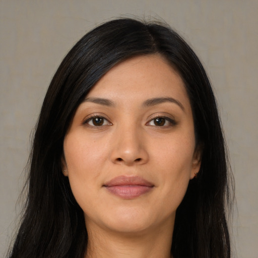 Joyful asian young-adult female with long  black hair and brown eyes