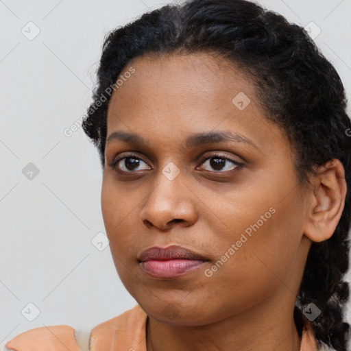 Neutral black young-adult female with short  brown hair and brown eyes